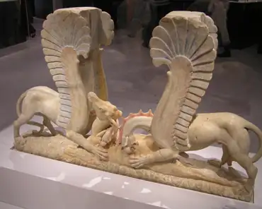 pc070077 Marble table leg in the form of 2 griffins attacking a deer, 325-300 BC. From Ascoli Satriano.